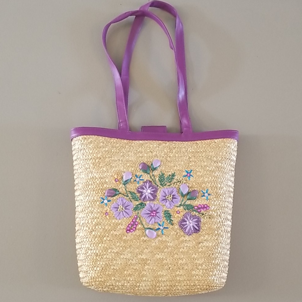 Straw tote with purple trim and floral detail